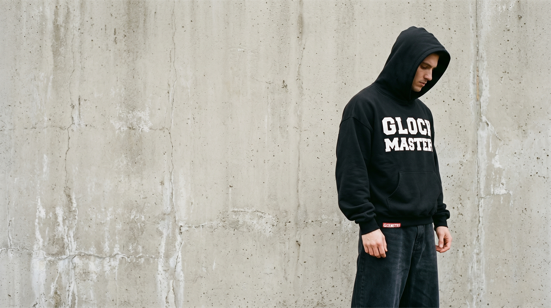 OG Sweatshirt on a model against a concrete wall